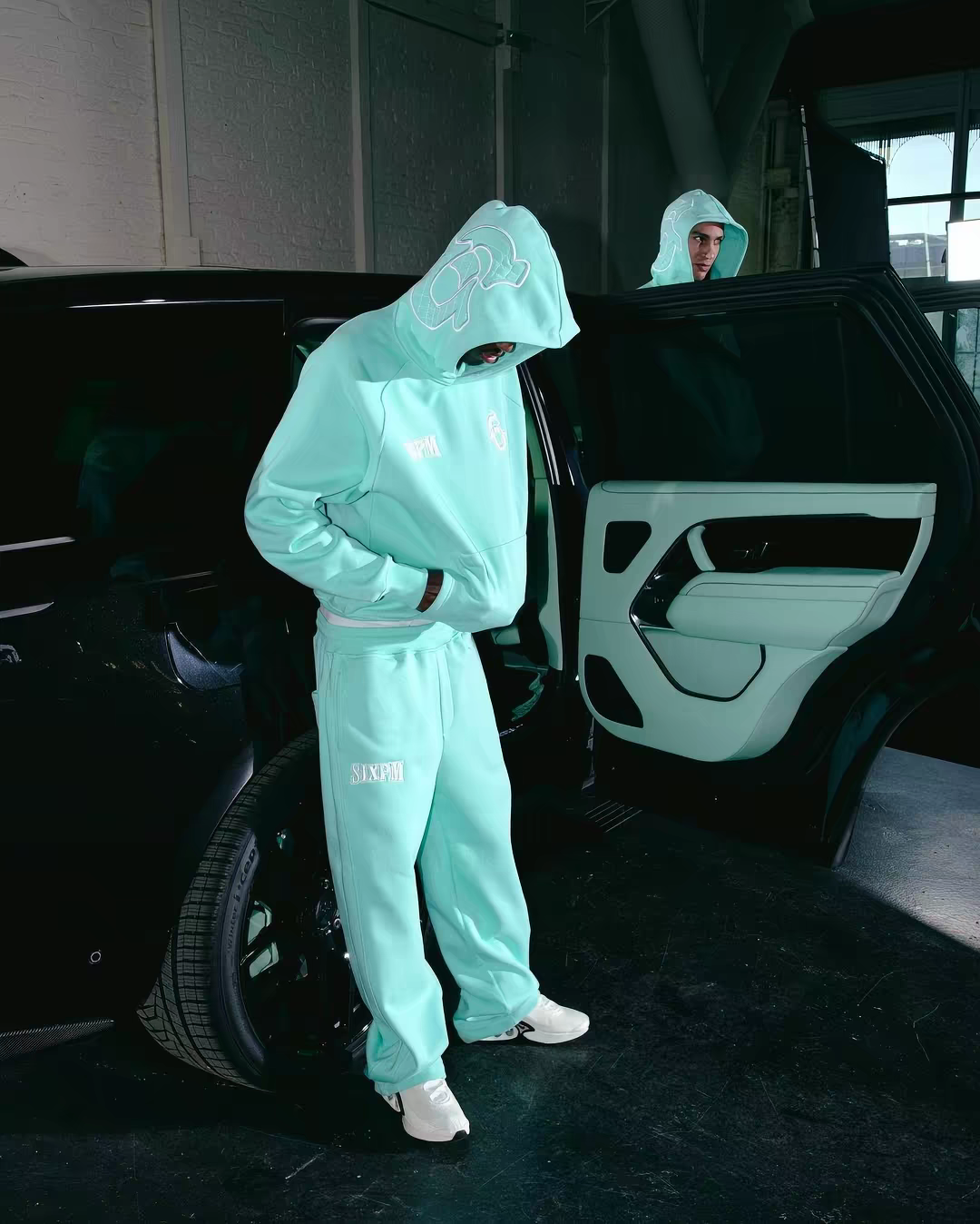 Mint 6PM Tracksuit worn beside a car